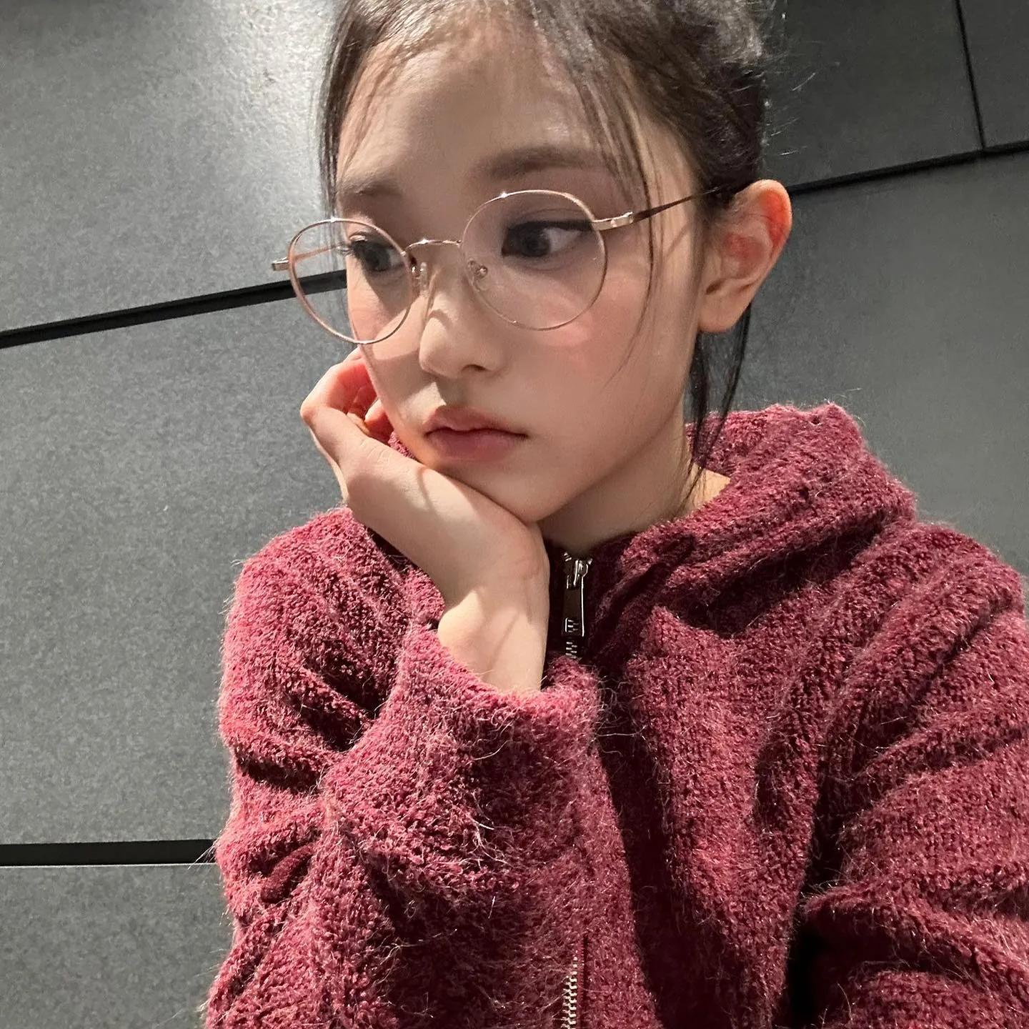 Lisa in cozy knitwear with glasses