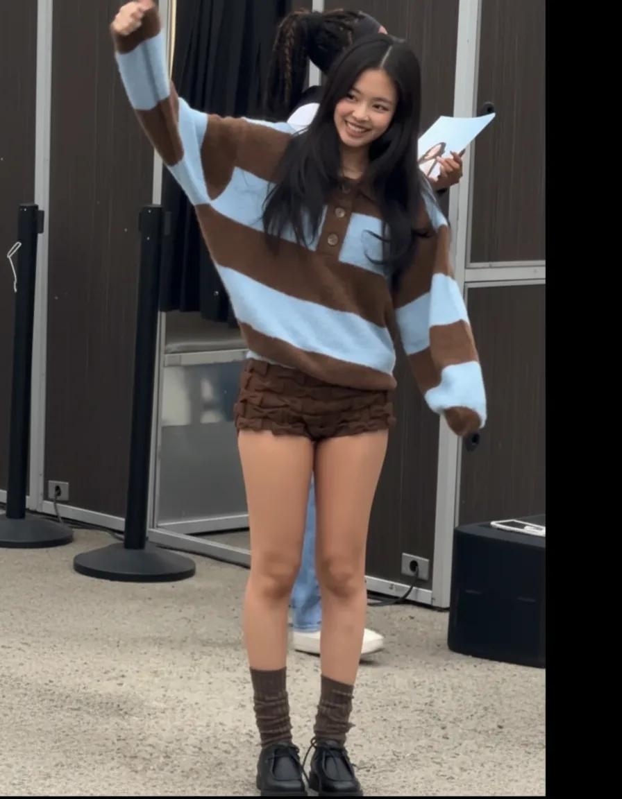 Jennie casual look in striped knit and ruffled shorts