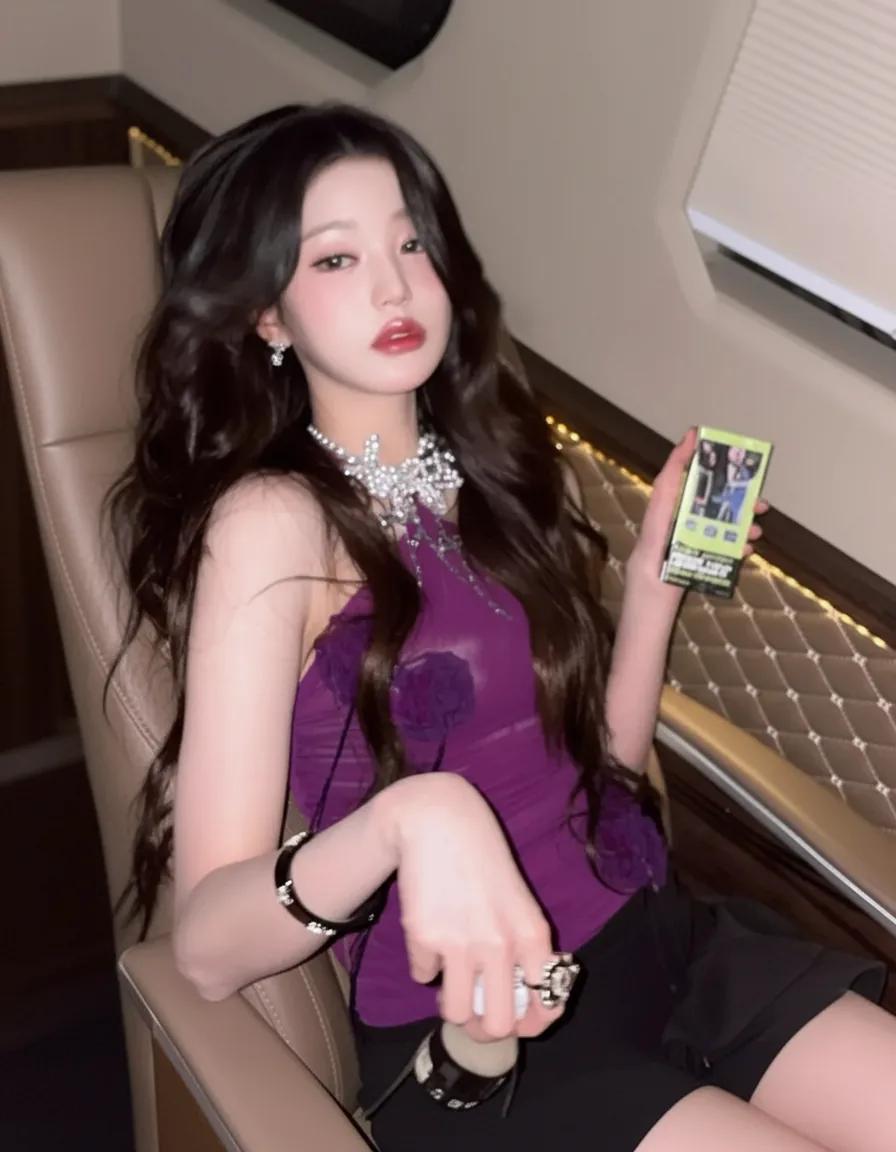 Jang Wonyoung's chic purple halterneck top look