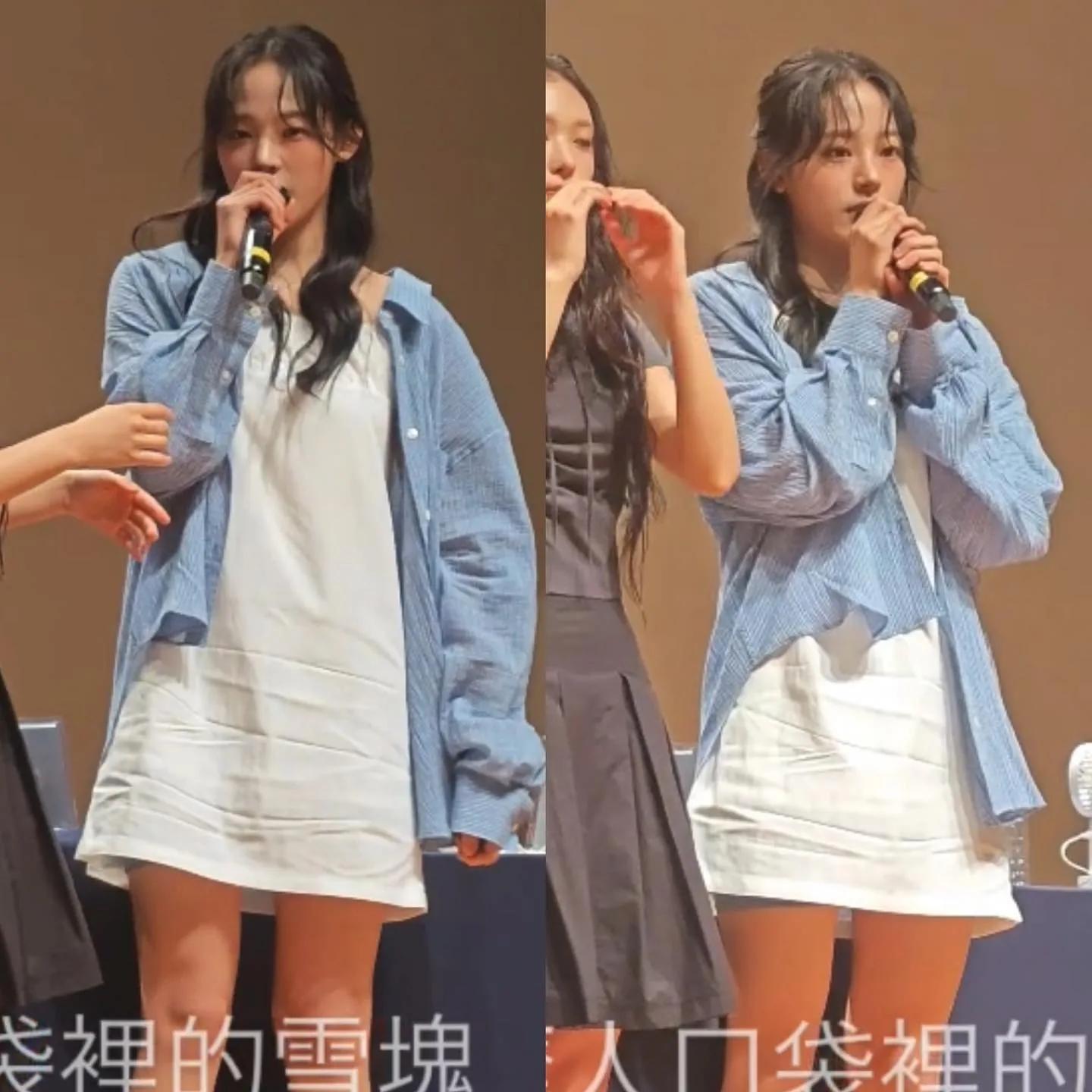 Lisa in oversized denim jacket and white mini dress